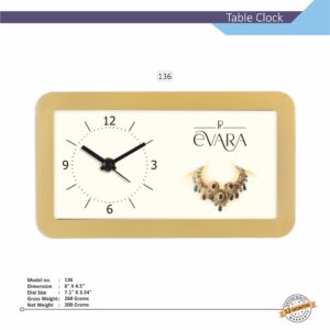 A golden custom branded table clock with an analog clock face and a blank space for a brand logo or photo.