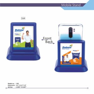 A high-angle, dual-view image of a blue Customizable Mobile Stand, model no. 164. The stand has a solid, broad base and a large display panel. The first view shows a phone secured in the stand with the front panel featuring custom branding with "Your Logo" and a man in an ad. The second view shows the back of the phone in the stand, with the back display panel featuring custom branding with "Your Logo" and product bags in ad. Product dimensions are visible below.